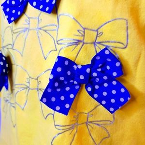 Girls Bold yellow top with bows 12months